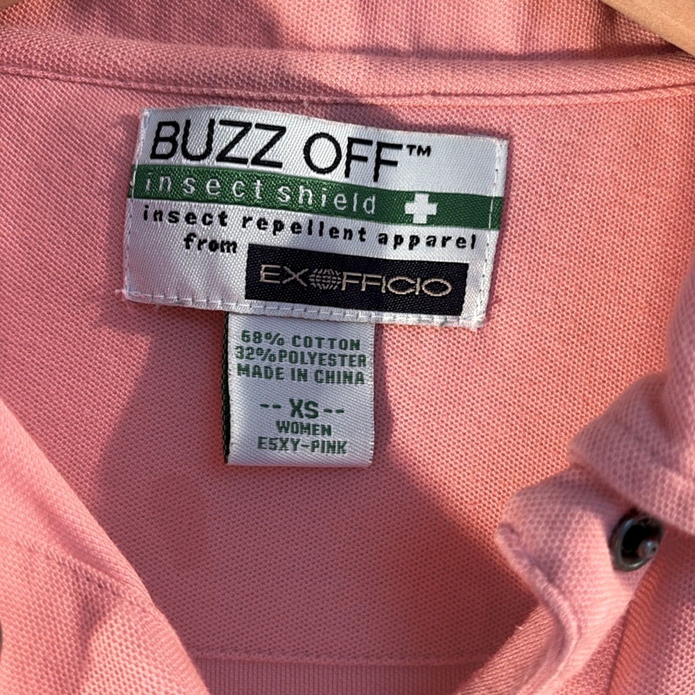 Vtg ExOfficio BuzzOff Snap closure pink top. With zipped sleeve pocket on 1 arm